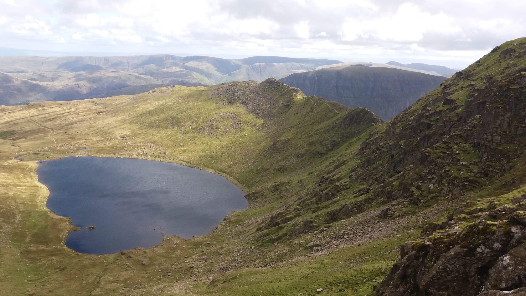 Hellvelyn, looking down on the tarn 
 At the Top! 
 Keywords: Hellvelyn, Looking down on the Tarn, The Herdwick Huts